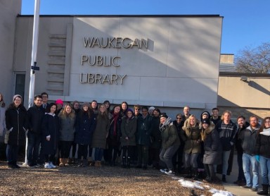 student teachers in front of school